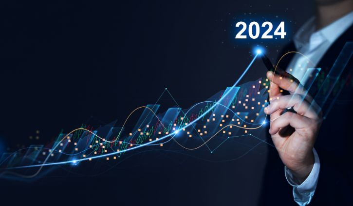 A person in a suit uses a digital pen to trace an upward trend line on a virtual financial chart, highlighting progress towards 2024 amidst economic uncertainty. The image features stock market graphs and data points in a futuristic style.